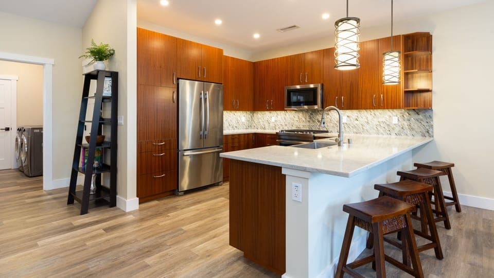 Large kitchen with gas range,  high end cabinets and ample space for preparing meals for big hungry families.