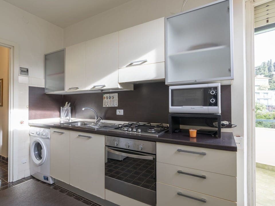 Cabinetry, Countertop, Property, Furniture, Building, Kitchen Stove, Kitchen Appliance, Plant, Kitchen, Wood