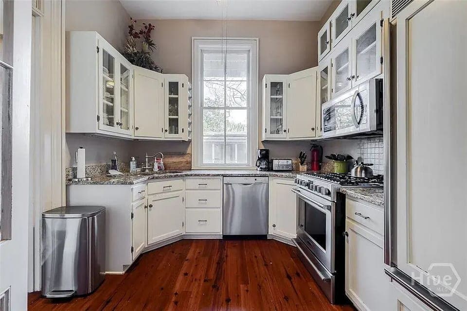 Kitchen with stainless appliances and granite counters.