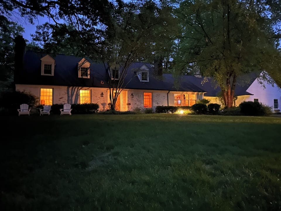 Spacious and charming Cape Cod Style home, in a beautiful park-like setting!  