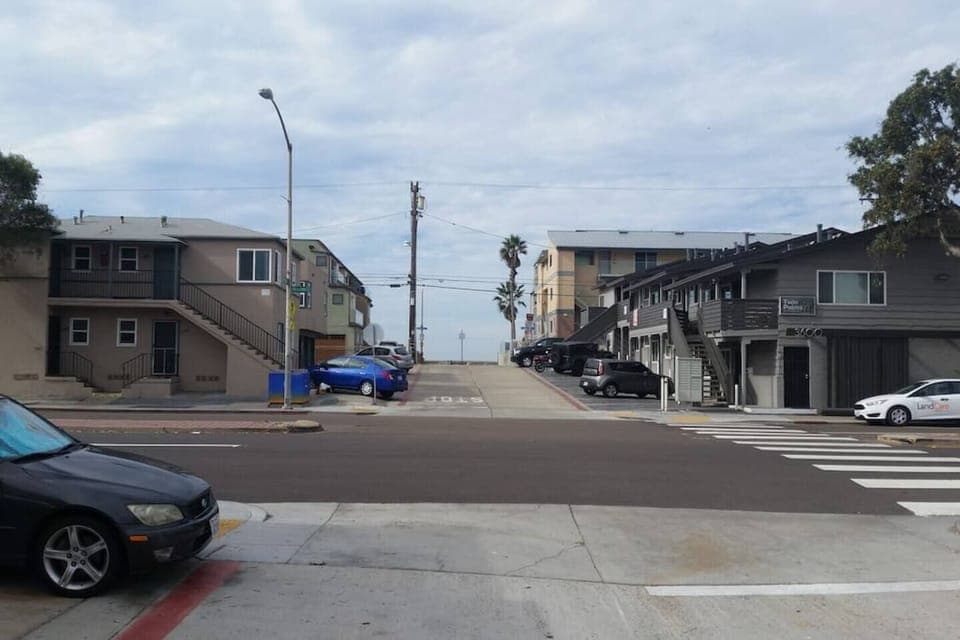 Walk across the street at the crosswalk and 1 minute later you are at the beach! The palm trees in the photo are the end of the road at the beach!