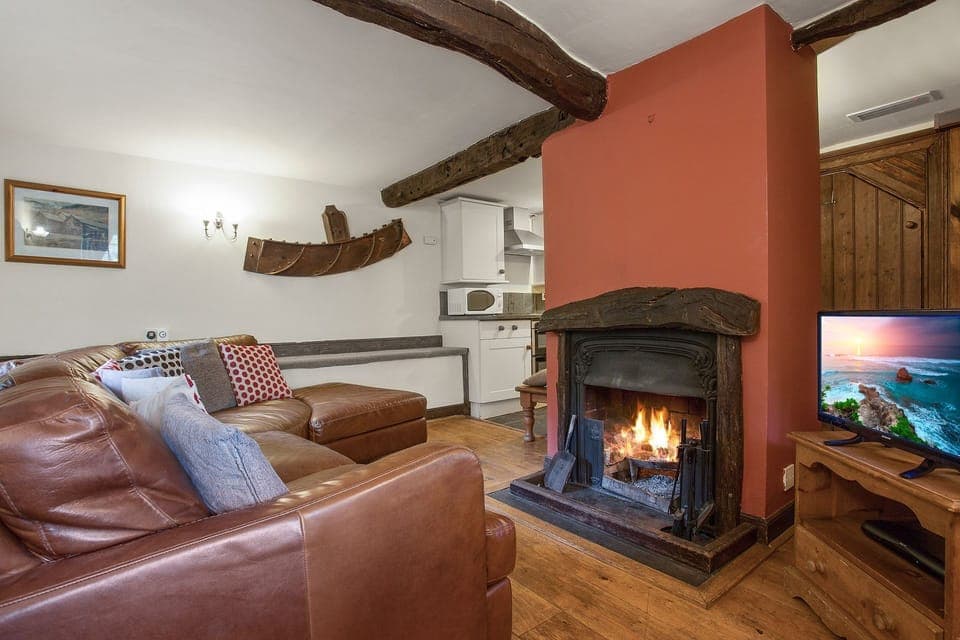 Millrace Mountain Cottage sitting room with open fire