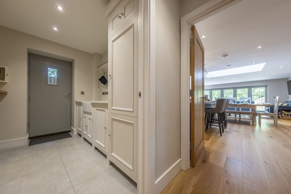 Ground floor: Utility room and back door beyond the living area