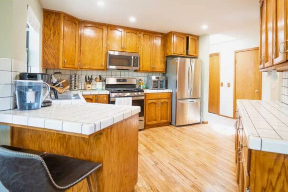 Well equipped kitchen with stainless steel appliances.