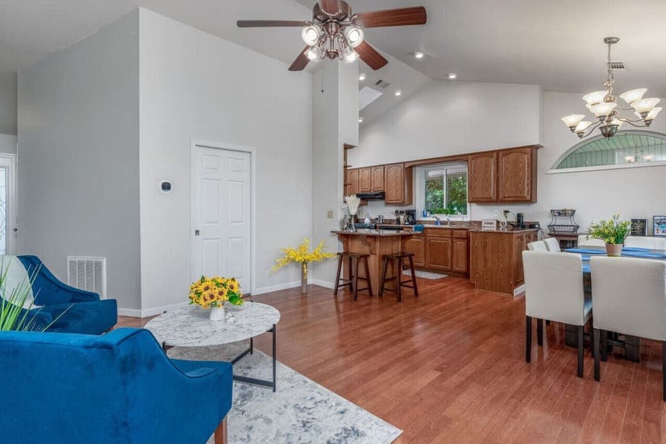 Spacious open-concept kitchen and living area with plenty of seating, natural light, and inviting charm.