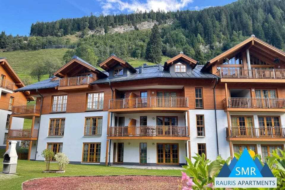Bask in the sunshine on one of the many private balconies, each offering picturesque views of the verdant Austrian Alps.  This traditional chalet, boasting spacious interiors and access to a luxurious spa, promises a truly unforgettable mountain escape.