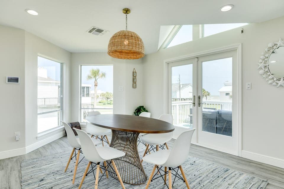 Walls of windows in the dining area give glimpses of the Gulf