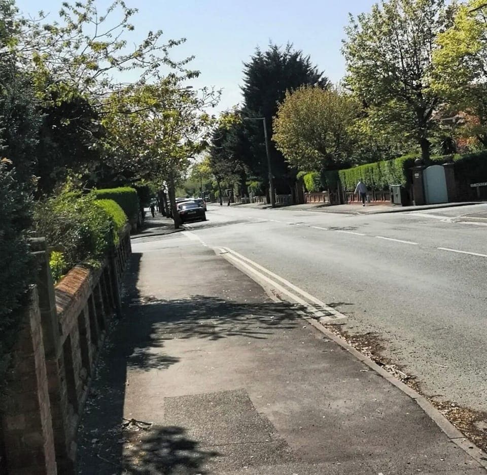 View from gate along the fabulous tree lined road into town and  beach
