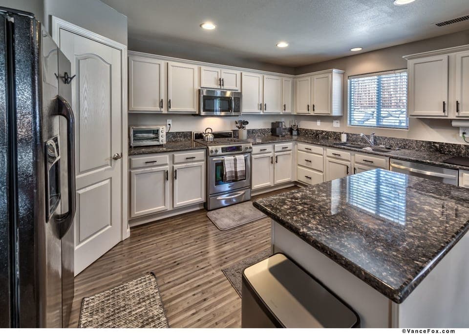 Large, spacious kitchen with plenty of cupboard space and large walk in pantry