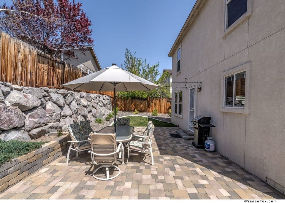 Spacious, private fenced in backyard with BBQ and outdoor lighting