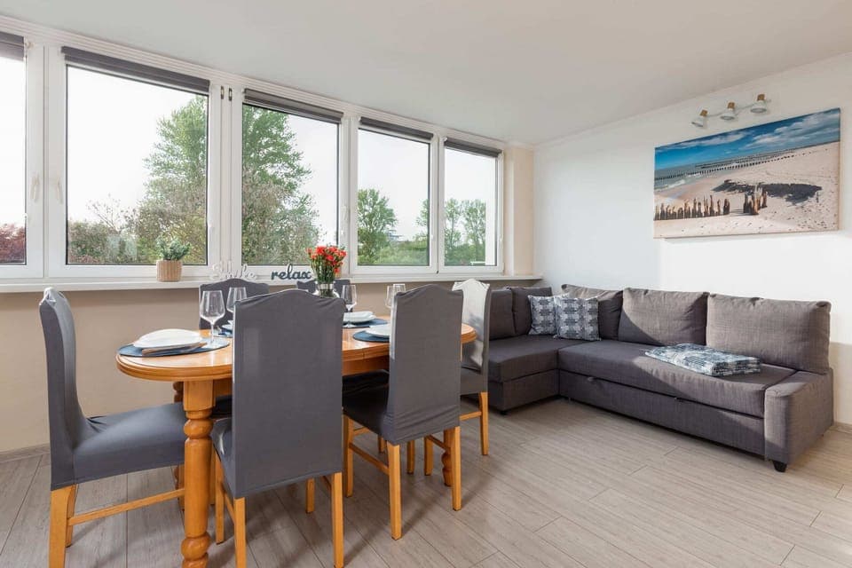 Relax in the stylish living room with a comfortable sofa and modern decor.