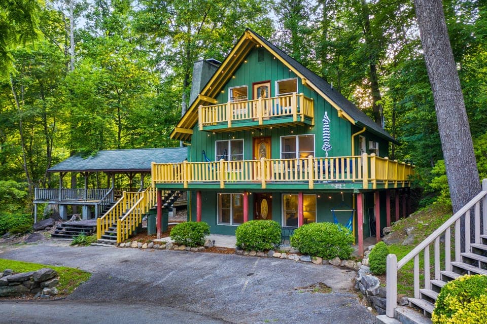Welcome to Chimney Summit Chalet, on the second and third floors of Chimney Chalet, accessible via the yellow stairs to the left. Relax on the porch and listen to the sounds of the Broad River while gazing at Chimney Rock State Park.