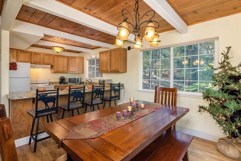 This is our cozy dining area with seating for 10 and a fully stocked kitchen