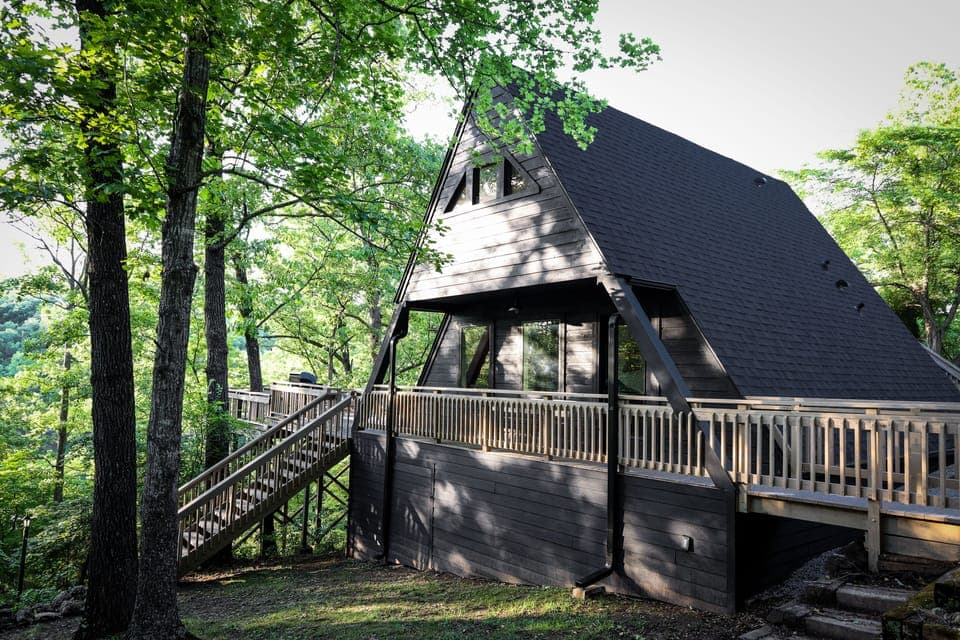 Private cabin featuring the classic A-Frame architecture with a sprawling deck.