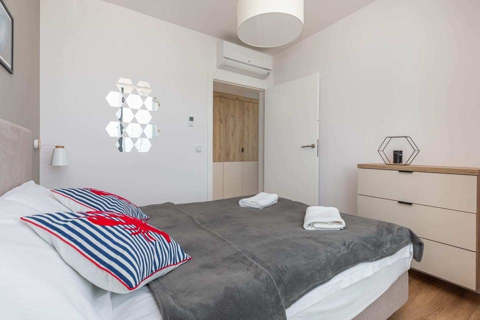 A large window in the bedroom allows for plenty of natural light. 