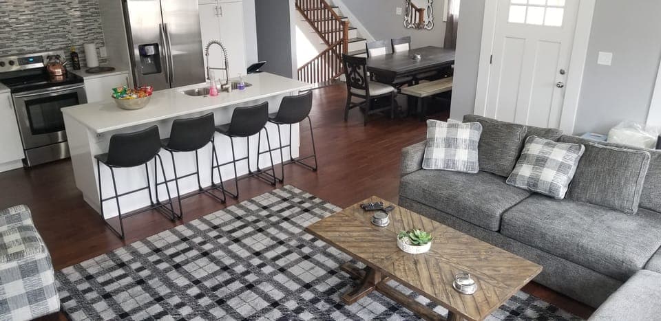 Living room 1, kitchen and dining room. Door on right leads to upper balcony.