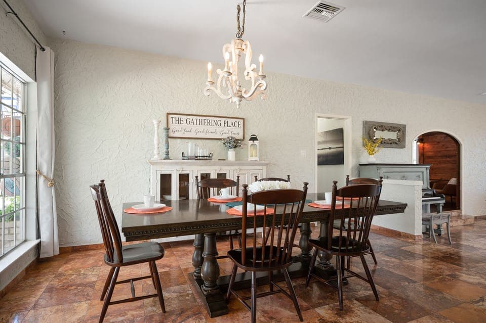 Dining Table that seats 8 or more people! The Hutch Cabinet in the dinning room also houses a number of decorative and practical pieces for guests use. 