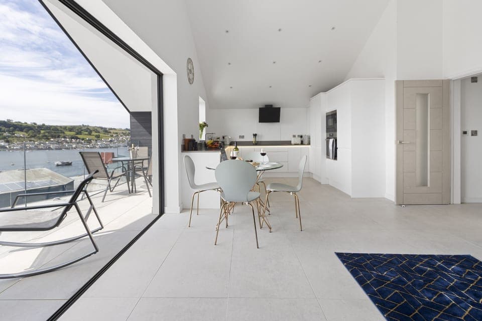 Open plan lounge, kitchen & dining area leading seamlessly onto the balcony.