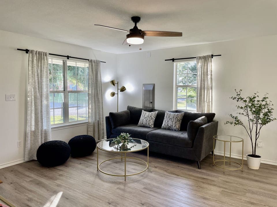 Cozy living room features queen memory foam mattress sleeper sofa & 50" Smart TV