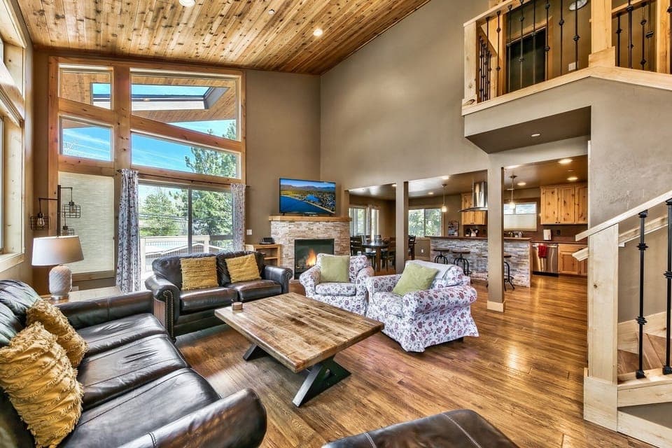 Living room with cozy fireplace, Smart TV and variety of books and games for all