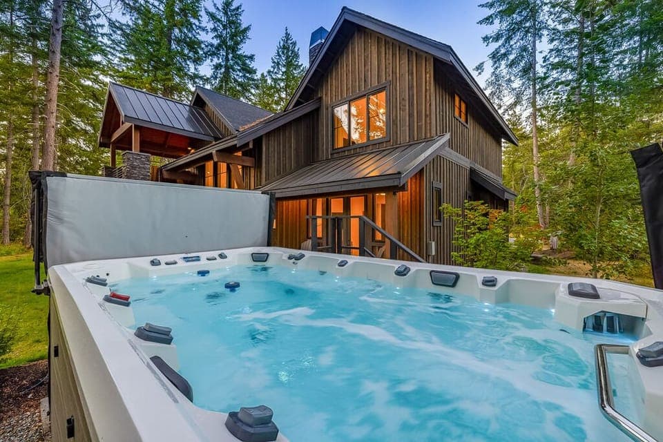 Indulge in the ultimate mountain retreat as you soak in the blissful warmth of this  outdoor 10-Person Swim Spa