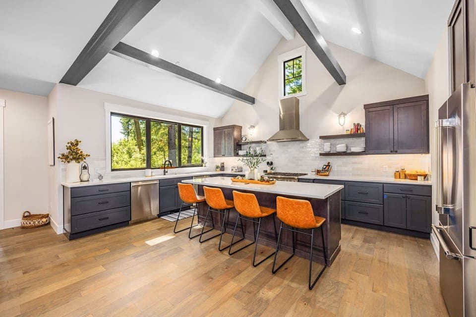 The spacious island offers ample seating, making it a perfect gathering spot for family and friends