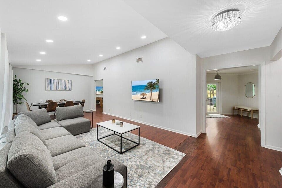 Spread out in the spacious layout of this Fort Lauderdale home, which offers 3 bedrooms & 2 full bathrooms, separate living area with a comfy sofa, a modern dining table, game room with ping pong & foosball tables, large kitchen with updated appliances and bar seating, TV's in all rooms, separate laundry room and contemporary touches throughout!

Stay with SoFlo Vacation Rental...