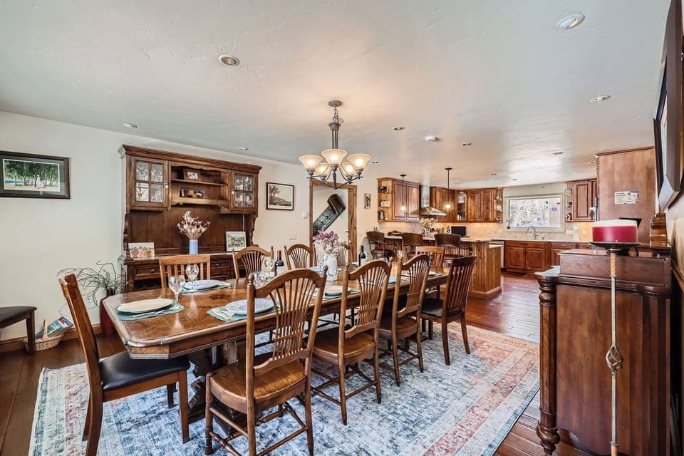 Huge dining room table with kitchen in background.  Table seats up to 14.  
