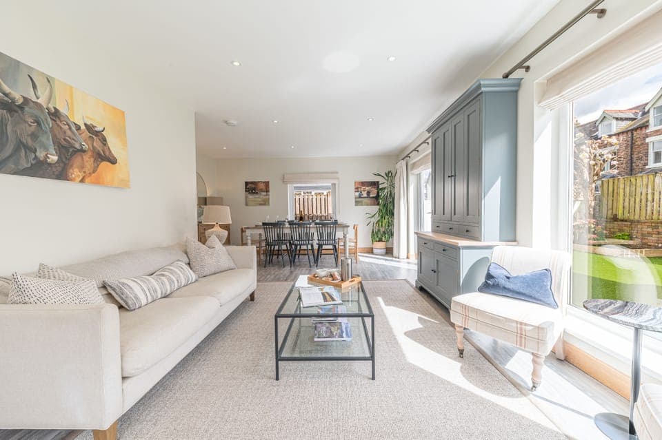 The L-shaped living and dining area is spacious and airy