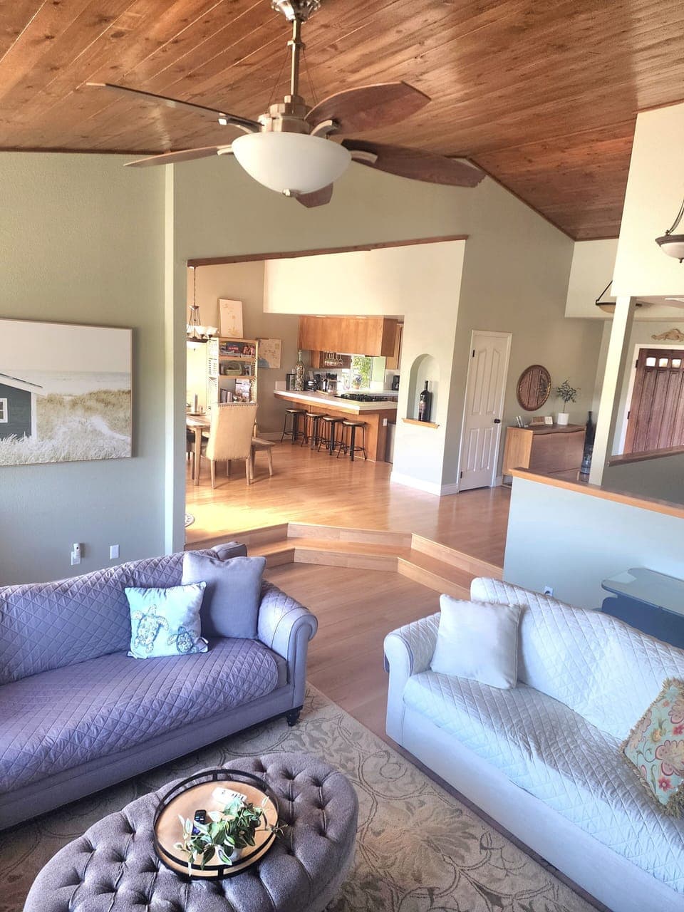 looking from the living room into the kitchen and dining room 