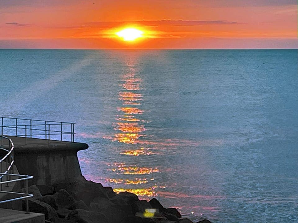 Sunset from terrace | Stones Throw Cottage, Sheringham