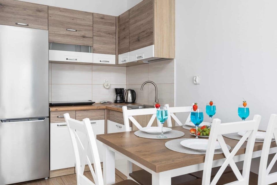 Large table with chairs for eating communal meals. 