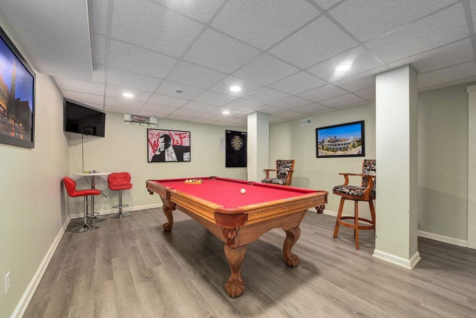 Basement with pool table and dart board
