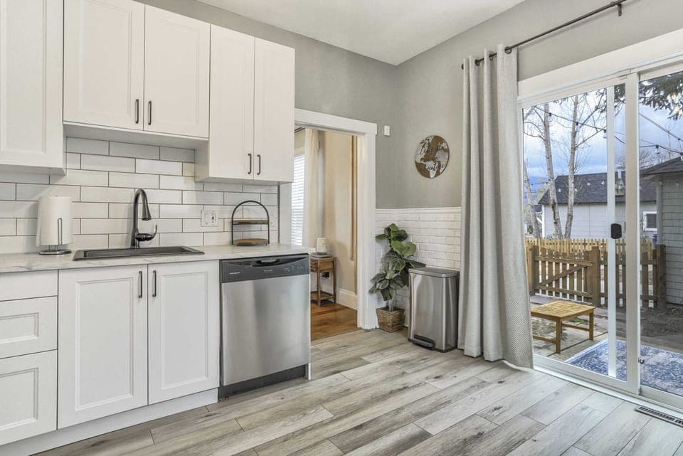 Our Spacious Kitchen Offers a Stunning View. A Full Glass Sliding Door Brings in Abundant Natural Light and Magnificent Views - Cooking has Never Been More Inspiring!