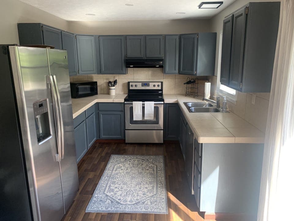 Fully equipped kitchen that overlooks the deck and lake.