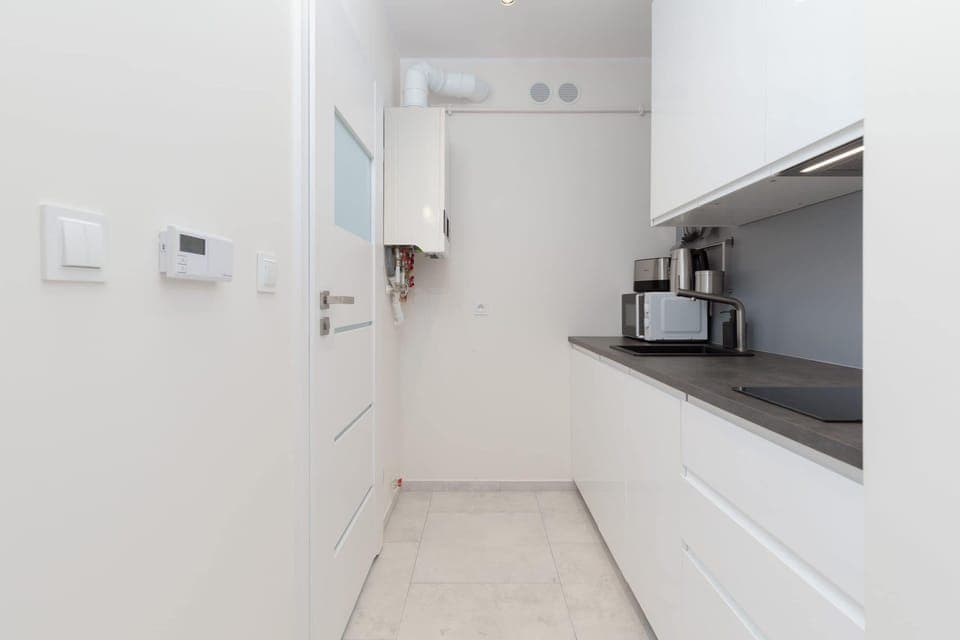 The fully equipped kitchenette includes everything you need for a home-cooked meal.