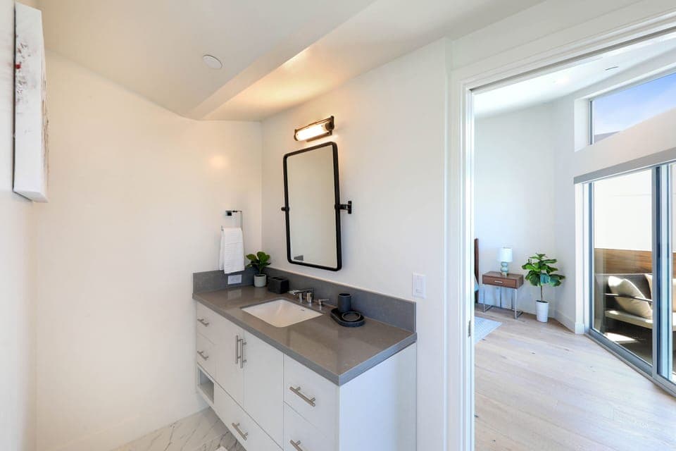 Ensuite master bathroom with separate sink areas