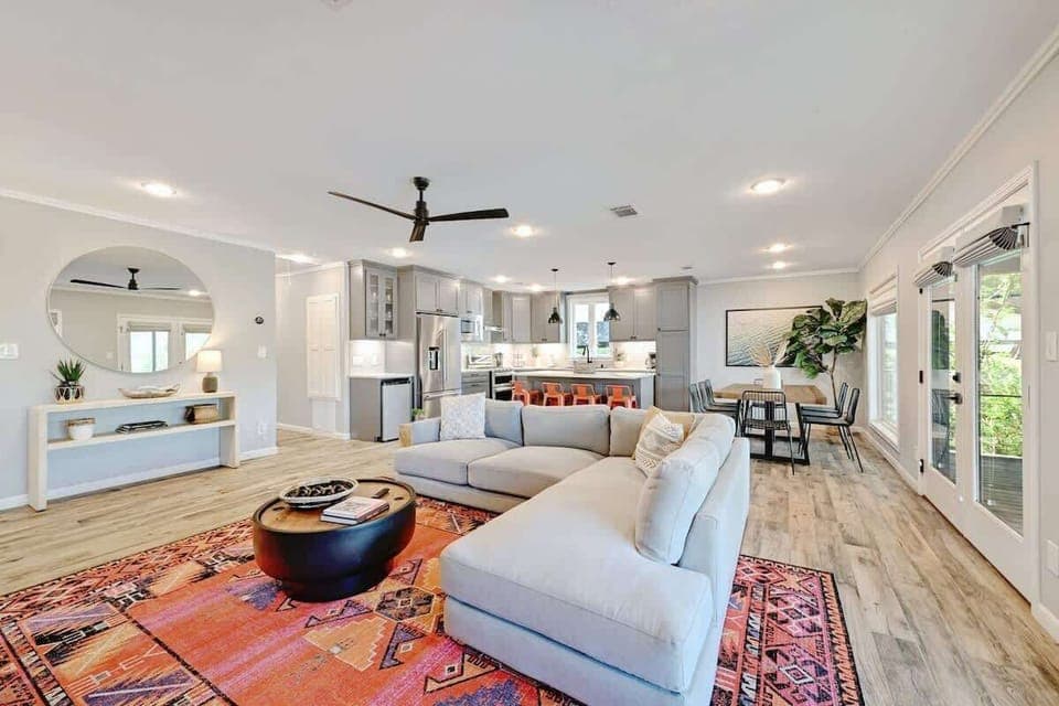 The living area offers plush seating and an open floor layout