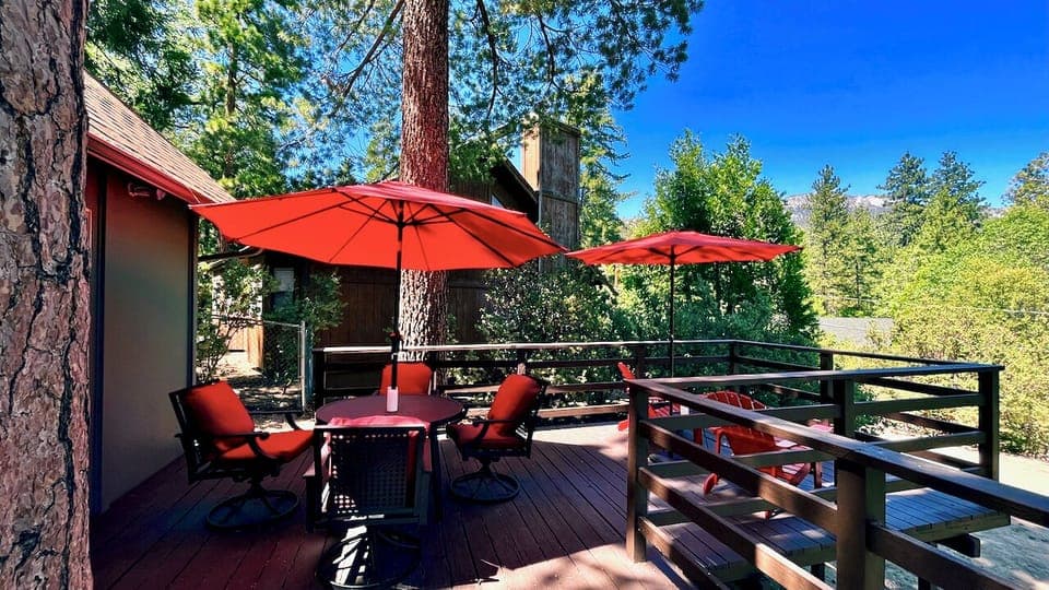 Enjoy the beautiful outdoor deck, perfect for dining or relaxation. Soak in the panoramic views from the spacious deck, complete with an outdoor dining set for four. Take a break and unwind in this peaceful oasis.