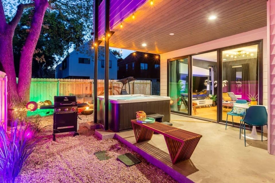 Outdoor Space With A BBQ Grill, Jacuzzi, And Seating Area, Perfect For Evening Relaxation