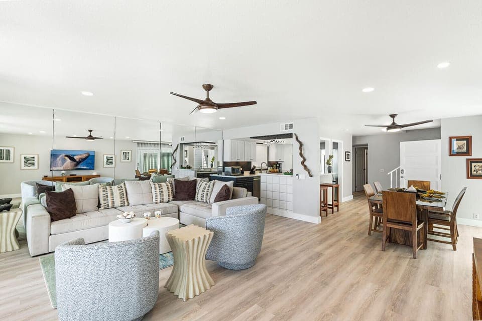 Spacious open-concept living room with direct flow into dining and kitchen spaces.