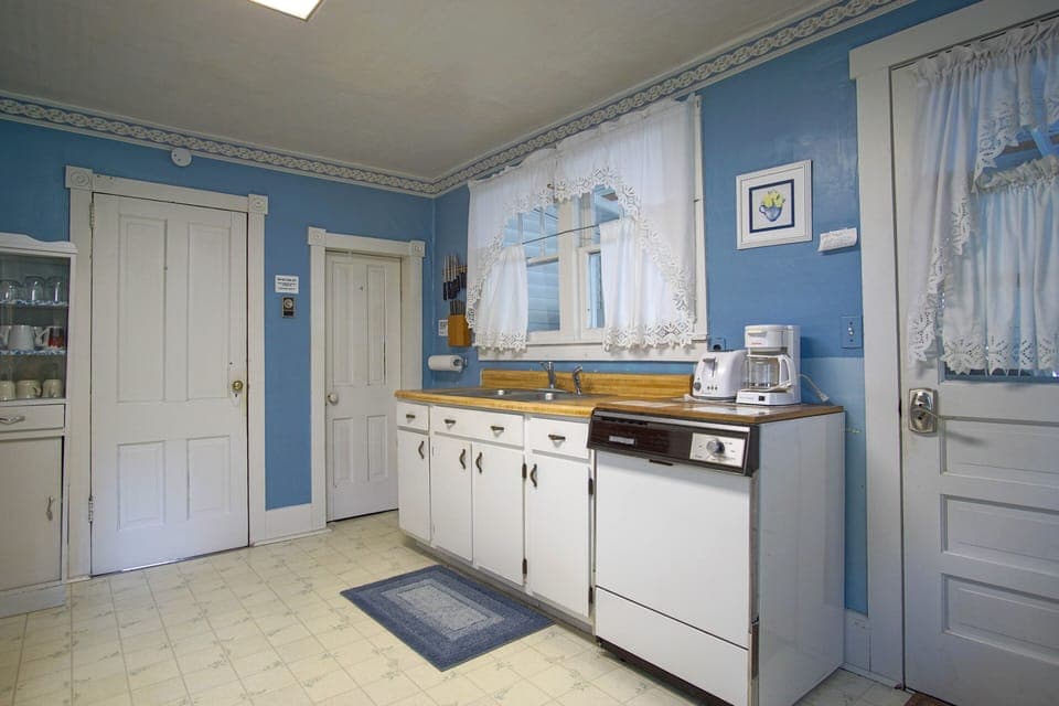Intimate and character-rich, this kitchen offers an authentic glimpse into the home's earlier days.