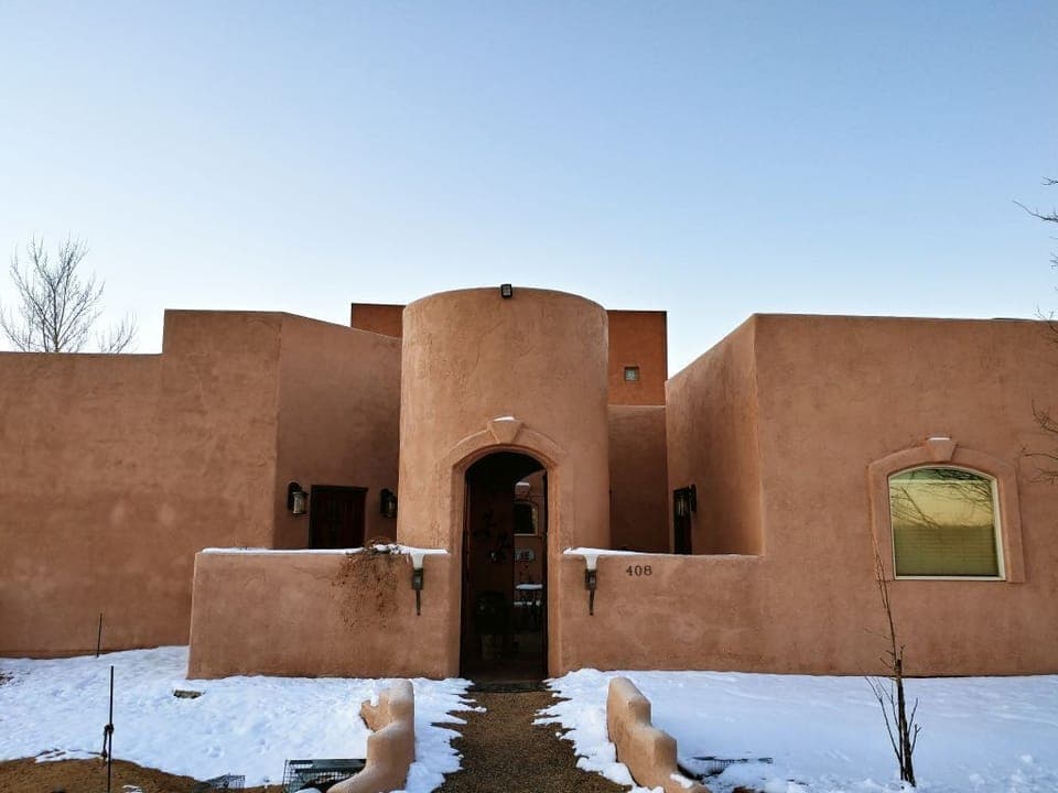 Front of house in the snow.