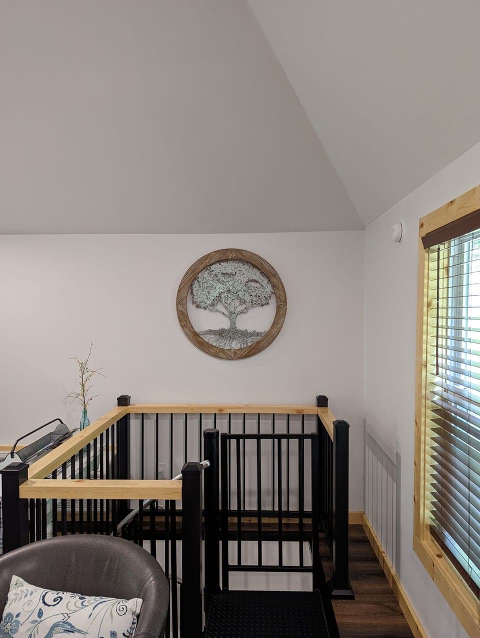 Spiral staircase leading to the lower level.