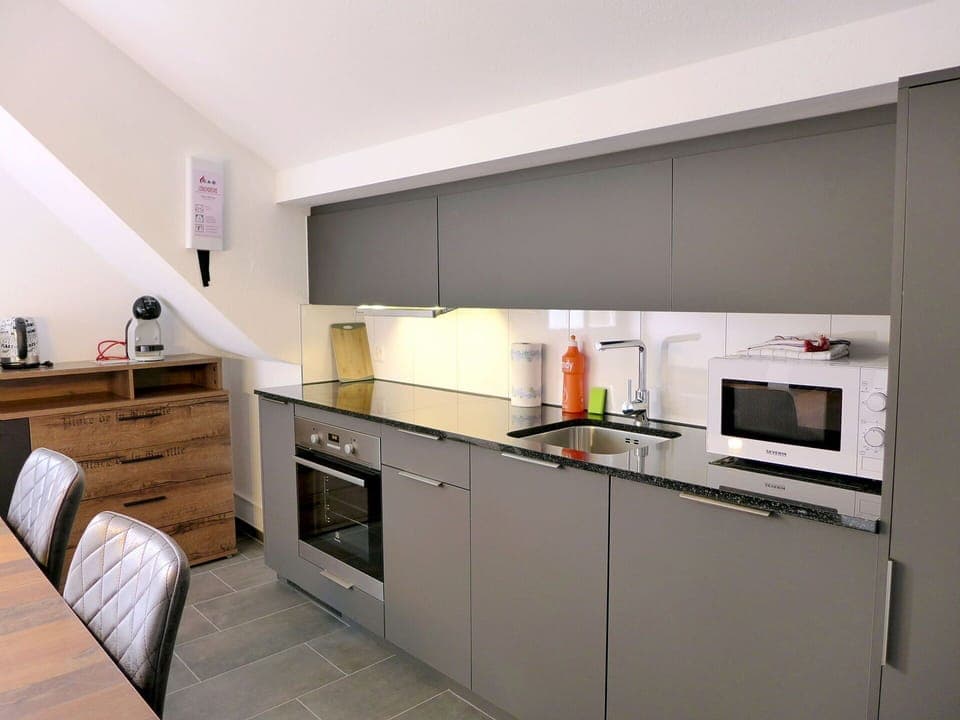 Cabinetry, Countertop, Kitchen Stove, Home Appliance, Kitchen, Kitchen Appliance, Building, Wood, Drawer, Gas Stove