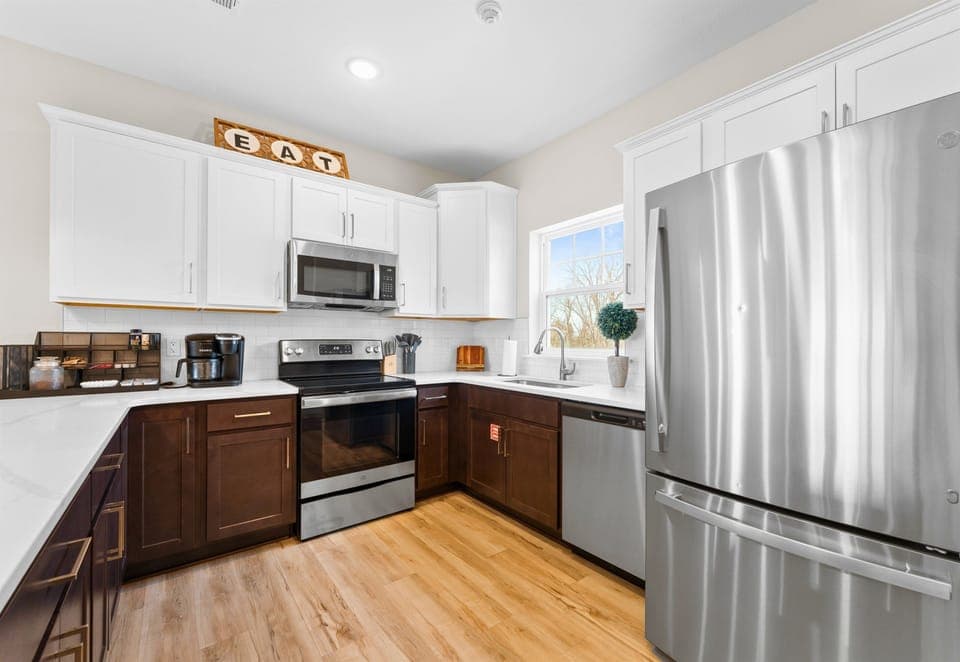 This modern kitchen is fully equipped, offering everything you need to whip up a delicious meal during your stay.