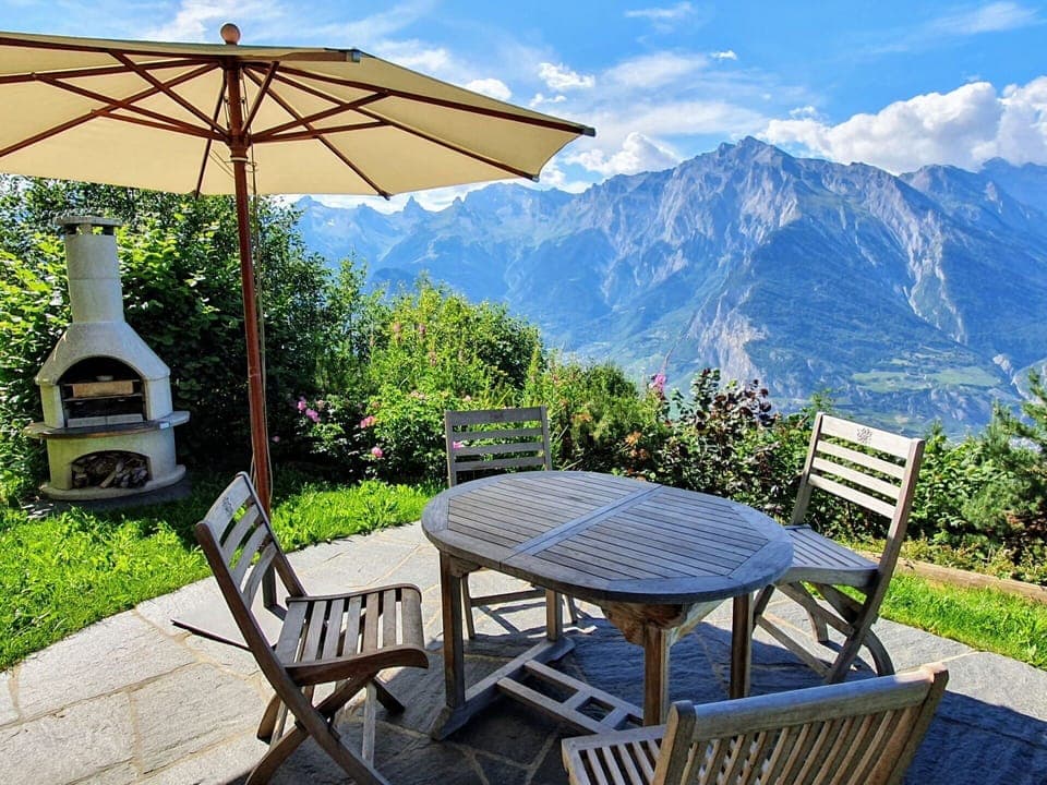 Plant, Table, Sky, Furniture, Property, Cloud, Mountain, Nature, Azure, Umbrella
