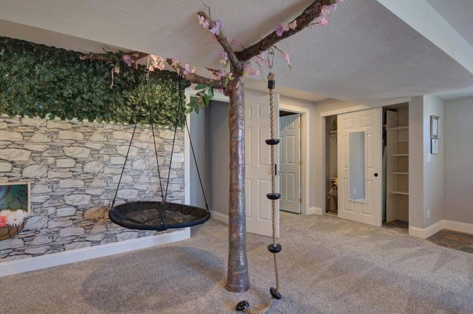Climbing structure and swing in lower level with plenty of storage in closets throughout 
