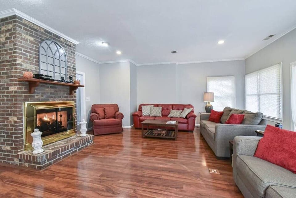 Living room with plenty of seating and gas log fireplace