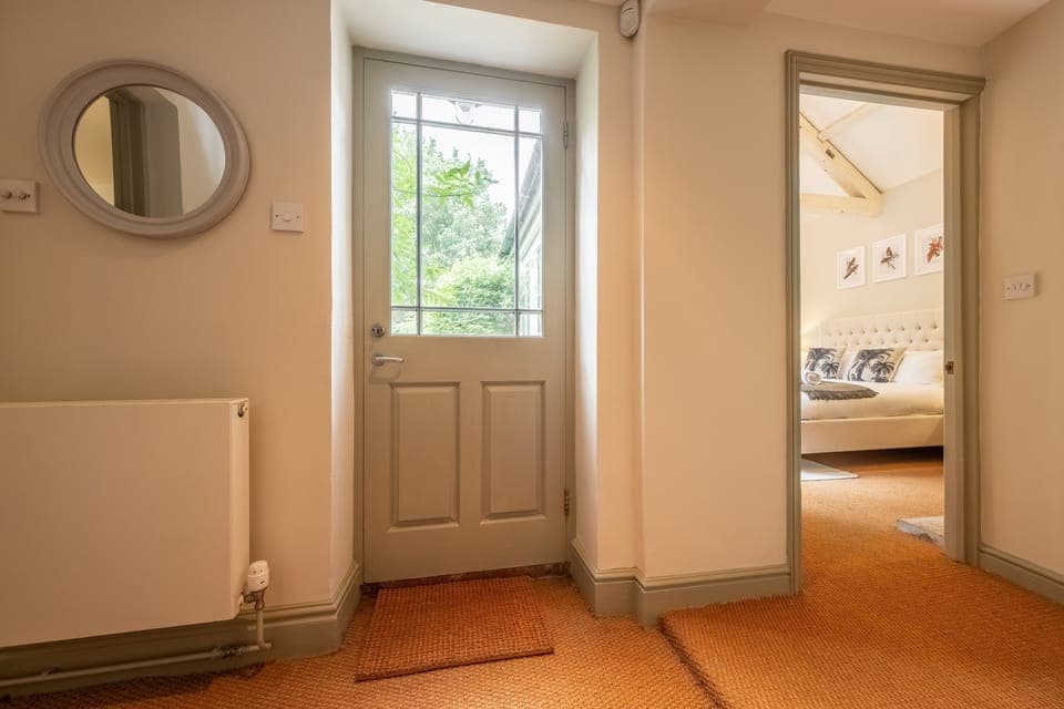 Ground floor: Showing the garden door and through to bedroom five